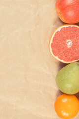 Ripe fruits on old paper. Healthy lifestyle. Fruits as source minerals and vitamins. Place for text