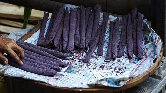 Vendor display Assamese traditional pitha, rice based snacks food items during Magh Bihu.