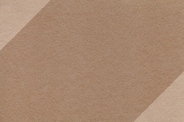 Fototapeta premium Brown paper texture background with beige diagonal edges and copy space for banner presentation template