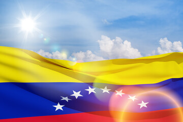 Fototapeta premium Venezuela flag on background of blue sky. Patriotic concept. Banner with place for text.