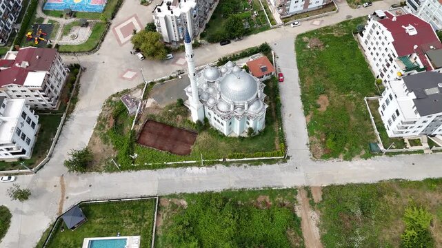 
Aerial top view of a multi-dome mosque roof with Islamic architectural symmetry and cinematic drone perspective