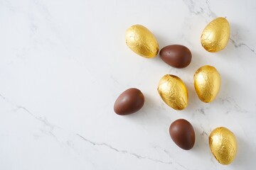 Elegant Chocolate Easter Eggs Flat Lay with Marble Background