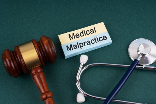 High angle view of gavel and stethoscope Medical Malpractice concept