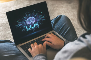 Remote User Interacting with a Laptop Displaying the LLM (Large Language Model) Concept for...