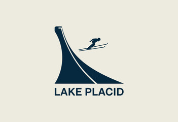 Stylized Logo of Lake Placid Featuring Ski Jumper in Dark Blue Against a Cream Background © VGX Ultra