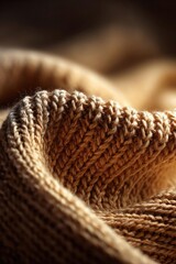 Obraz premium Close-up of a thick tan knitted fabric with chunky yarn and ribbed texture. Concept Thick tan knit close-up, Chunky yarn texture, Ribbed knit details, Neutral color palette, Cozy winter fabric