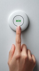 Finger presses eco button signaling sustainable choice and environmental action in modern technology