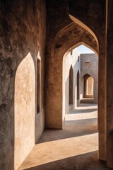 Obraz premium Sunlit corridor of a desert fortress with repeating archways and long shadows across the warm stone floor. Concept Desert fortress architecture, Sunlit archways, Repeating arches