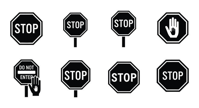 Collection of black and white stop signs and hand halt symbols displayed