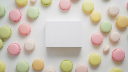 Colorful Macarons and Candies with Blank Box on White Background