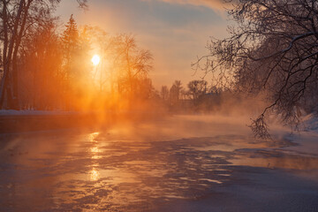 A frosty dawn by the river in a city park in Minsk