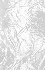 Wrinkled transparent plastic film background on a white background.