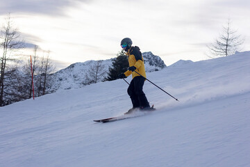 Happy family in winter clothing at the ski resort, winter time