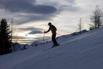 Happy family in winter clothing at the ski resort, winter time