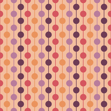 Warm retro geometric seamless pattern in mid century modern style with abstract dots and circle motifs. Soft peach modern vintage background ideal for decorative and design use.