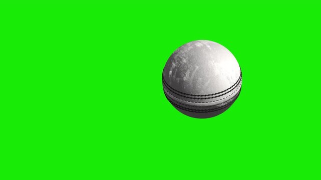 white leather cricket ball on green background