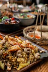 Thai chicken fried rice with pineapple and cashew on modrn bangkok restaurant table in thailand