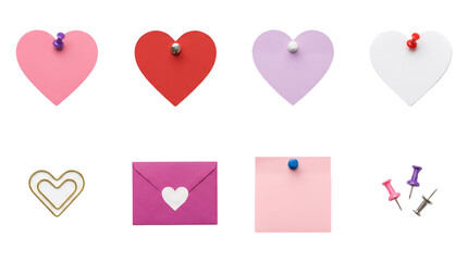 Stationery set including heart shaped notes, envelope, paper clip, and pushpins isolated. Valentine's day office supply collection.