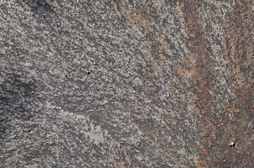 岩の表面のテクスチャ。ザラザラした質感の自然な石の背景素材