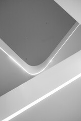 Abstract minimalist architectural detail with curved lines and integrated LED lighting.