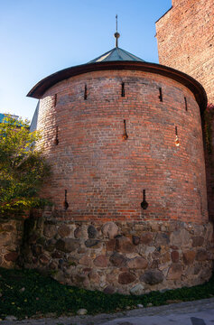 Fortified tower is Renaissance defensive structure of 16th-century brick bastion, inverted keyhole embrasures (loopholes), upper level features slit-shaped embrasures. Tarn&oacute;w, Poland.