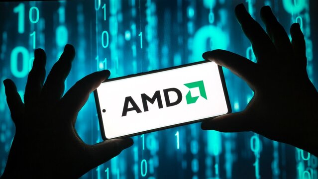 Hands holding smartphone with AMD logo on screen