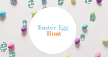 Image of easter egg hunt text over colourful easter eggs on white background