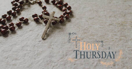 Image of holy thursday text over christian rosary on grey background