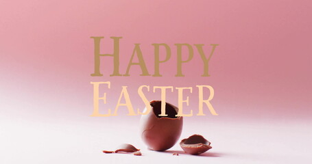 Image of happy easter text over cracked chocolate easter egg on pink background
