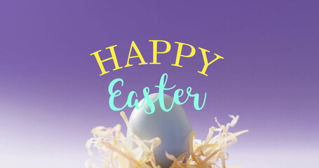 Image of happy easter text over blue easter egg in hey on purple background