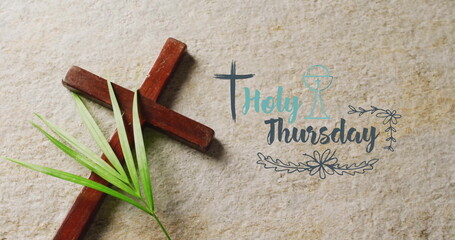 Image of holy thursday text over christian cross and palm leaf on grey background