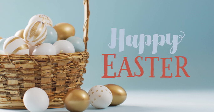 Image of happy easter text over white and gold easter eggs in bucket on blue background - Powered by Adobe