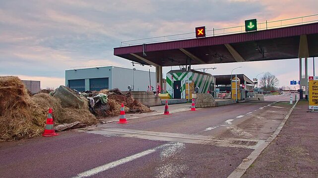 Semur-en-Auxois, FRANCE - JANUARY 16, 2026: Agricultural debris and soil cleared from A6 highway exit 23 following French farmers' protest. Road access restored after blockade at toll booth.
