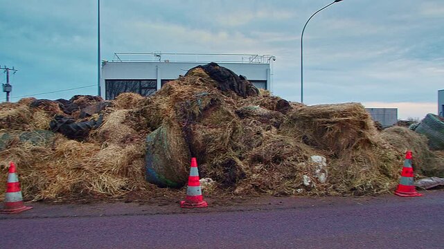 Semur-en-Auxois, FRANCE - JANUARY 16, 2026: Agricultural debris and soil cleared from A6 highway exit 23 following French farmers' protest. Road access restored after blockade at toll booth.

