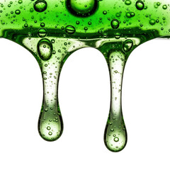 Green liquid dripping with bubbles isolated on transparent background