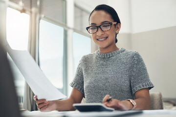 Home budget, finances and bills being calculated by a young woman sitting at home. Young female calculating her expenses, debt and spendings while doing monthly tax returns or planning in the lounge © peopleimages.com