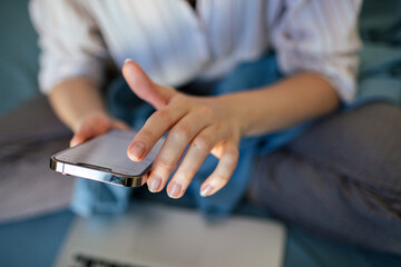 Close-up of person using smartphone at home