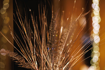 Golden Decorative Branches with Glitter and Warm Bokeh Lights
