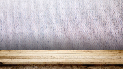 An empty rustic wooden table top against a light purple fabric-like textured wall background. Perfect for product display, presentation, and food photography mockups