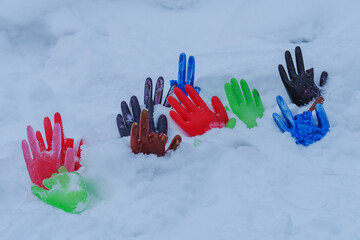 colorful hand prints on snow © talavietis
