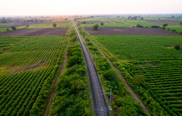 Naklejka premium Landscape of railroad tracks in India cutting across rural countryside