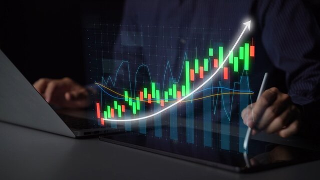 A professional engaged in financial analysis using modern technology, showcasing a colorful stock market graph on digital devices in a dark atmosphere. Copula - Powered by Adobe