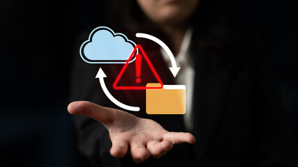 A business professional illustrates cloud computing concepts with warning signs, emphasizing technology risks and data management strategies in a digital age. Gantry