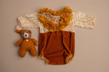 Newborn clothes with toys and flowers in a beautifully folded position for a photo © VideofotKA