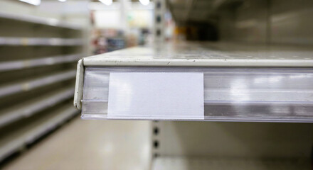 Rear View of Hacker Sitting in Front of Wall of Monitors