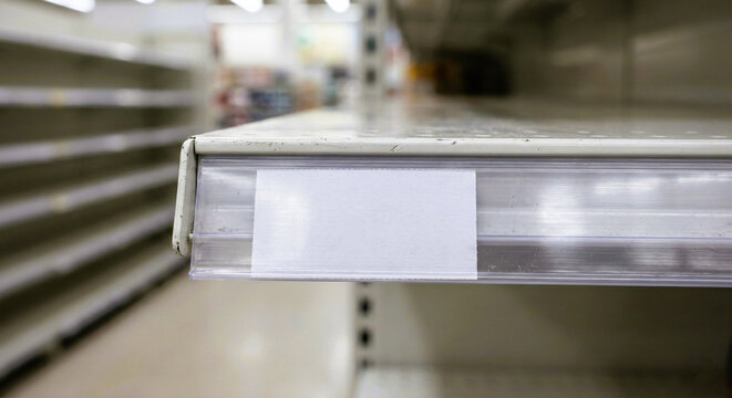 Rear View of Hacker Sitting in Front of Wall of Monitors - Powered by Adobe
