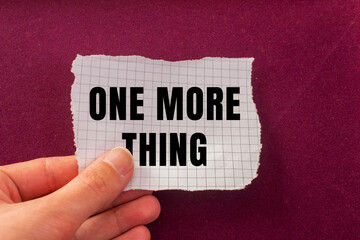 One More Thing message written on ripped torn paper background. Conceptual One More Thing symbol. Copy space.
