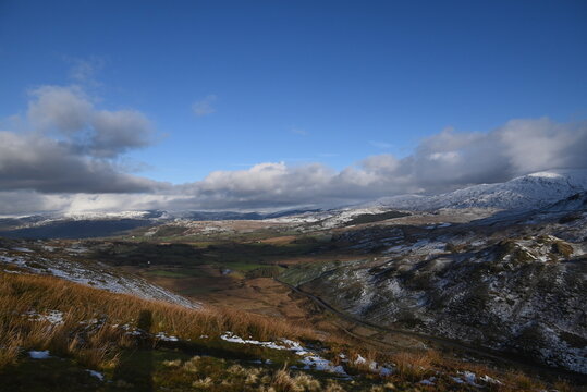 a view walking up a snowy Cadair Idris in south Gwynedd, wales from the mach loop