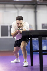 Male athlete serving ball during table tennis match © KONSTANTIN SHISHKIN
