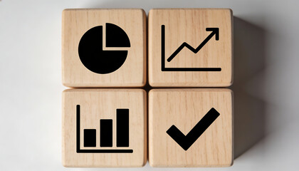 Four wooden cubes in grid with pie line and bar charts and check icon representing business analytics data visualization metrics reporting and success concept
